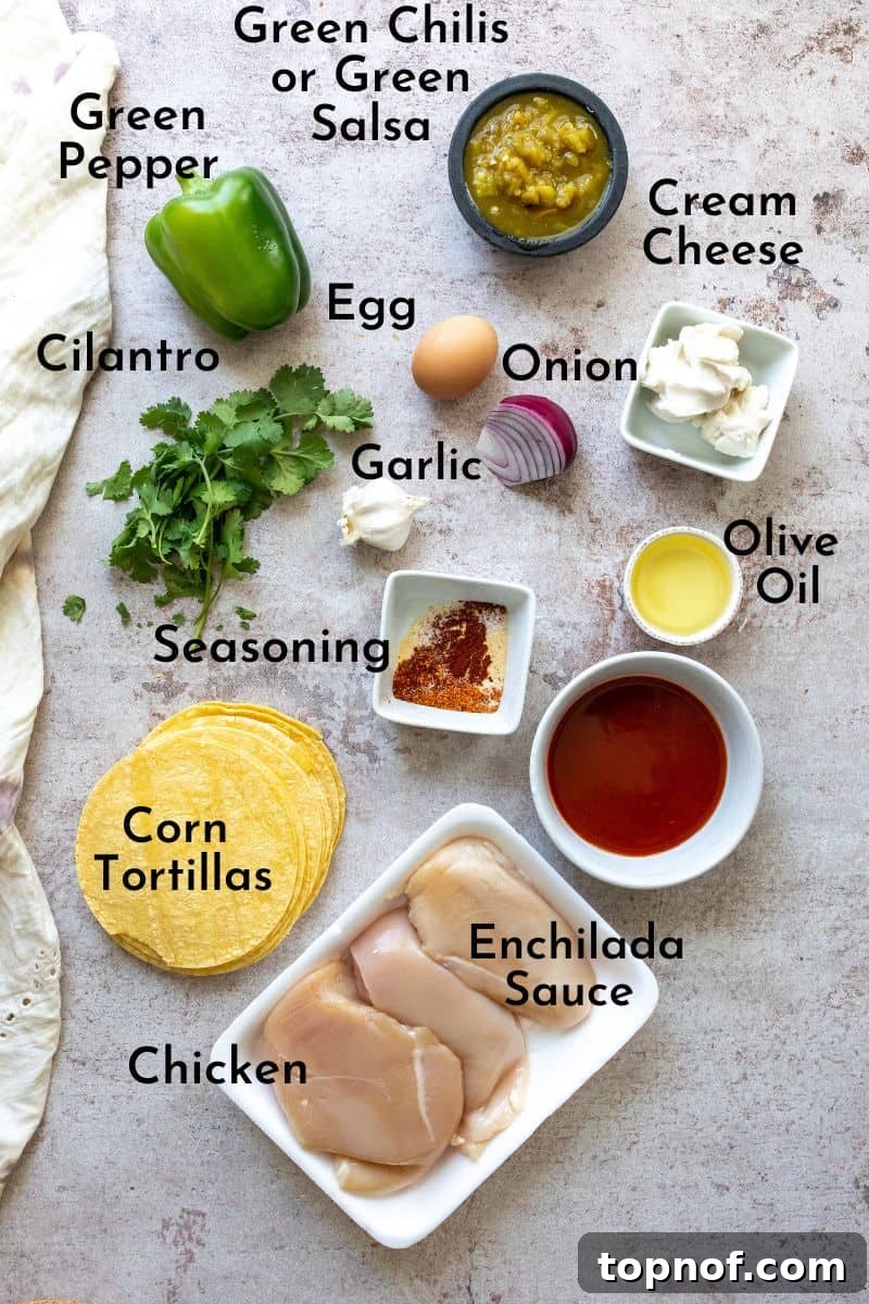 Golden Crisp Chicken Taquitos 3 A selection of fresh ingredients laid out on a kitchen counter, including chicken breasts, green bell peppers, red onions, a block of cream cheese, and a jar of enchilada sauce, ready for making taquitos.