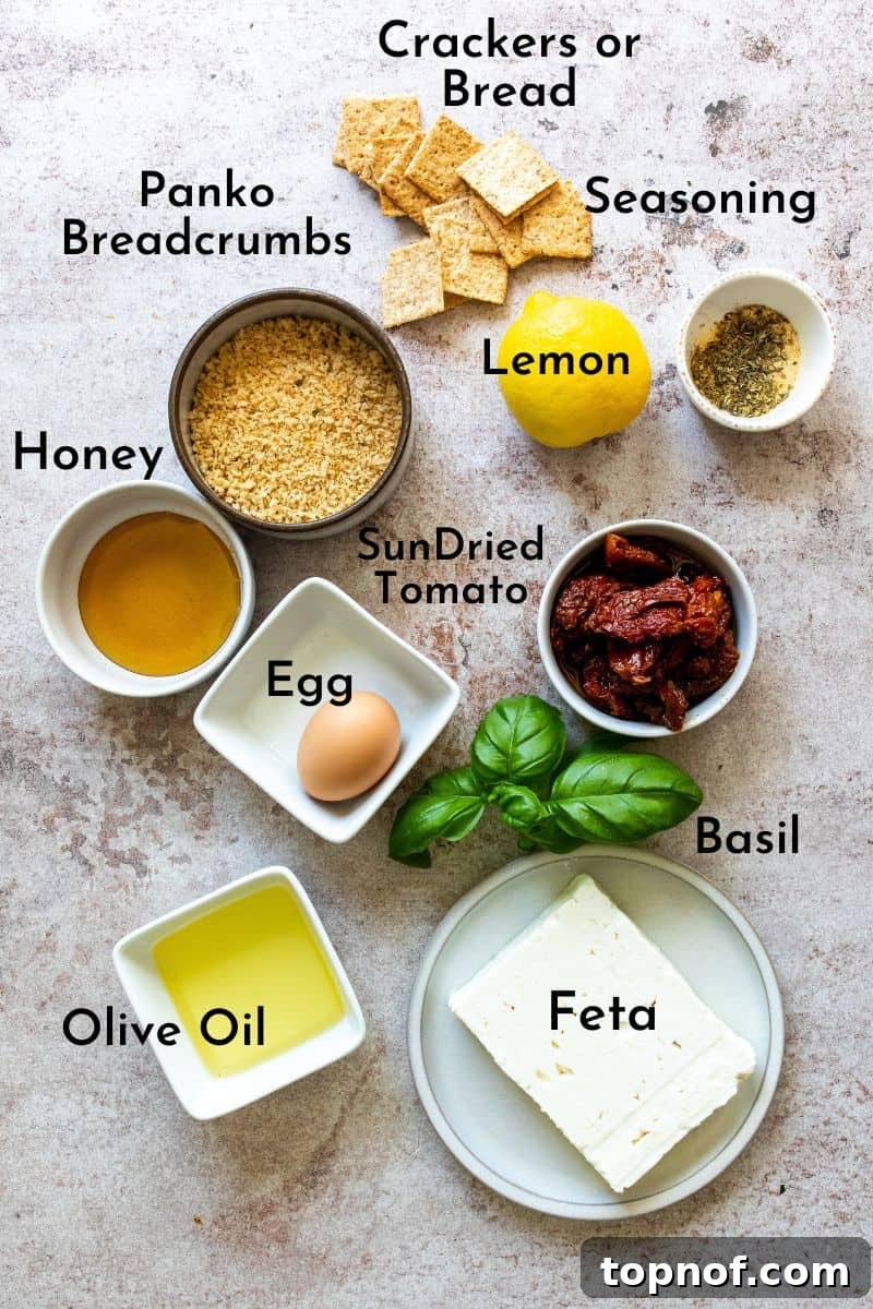 Golden Feta with Fiery Honey Drizzle 3 Assorted bowls showcasing the key ingredients for Pan Fried Feta: a block of feta, panko breadcrumbs, sun-dried tomatoes, fresh basil, garlic powder, Italian seasoning, salt, pepper, cayenne, red pepper flakes, and a lemon.