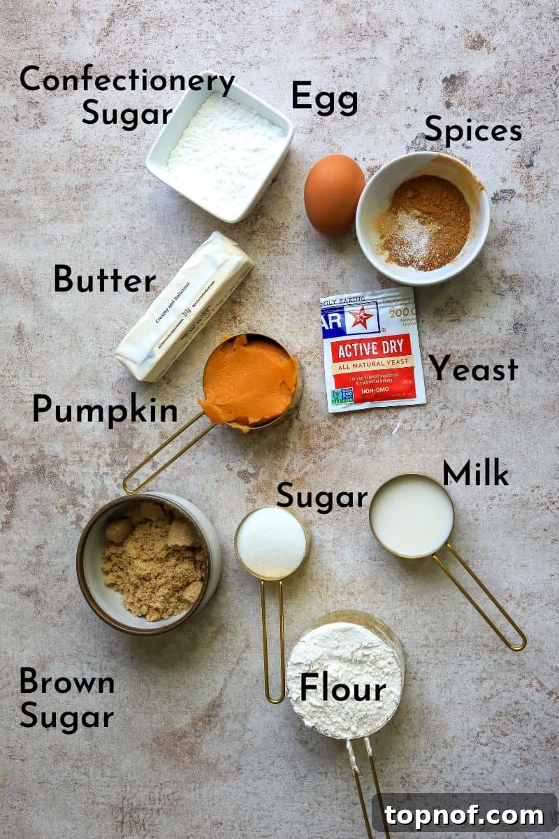 Warm Spiced Pumpkin Rolls 3 Arrangement of ingredients needed for pumpkin cinnamon rolls, including flour, pumpkin puree, spices, and butter.