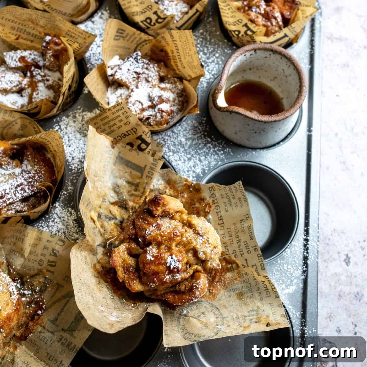 Irresistible Chocolate Chip Bread Pudding 7 Chocolate chip bread pudding baked in muffin liners, showcasing individual servings of this delightful dessert.