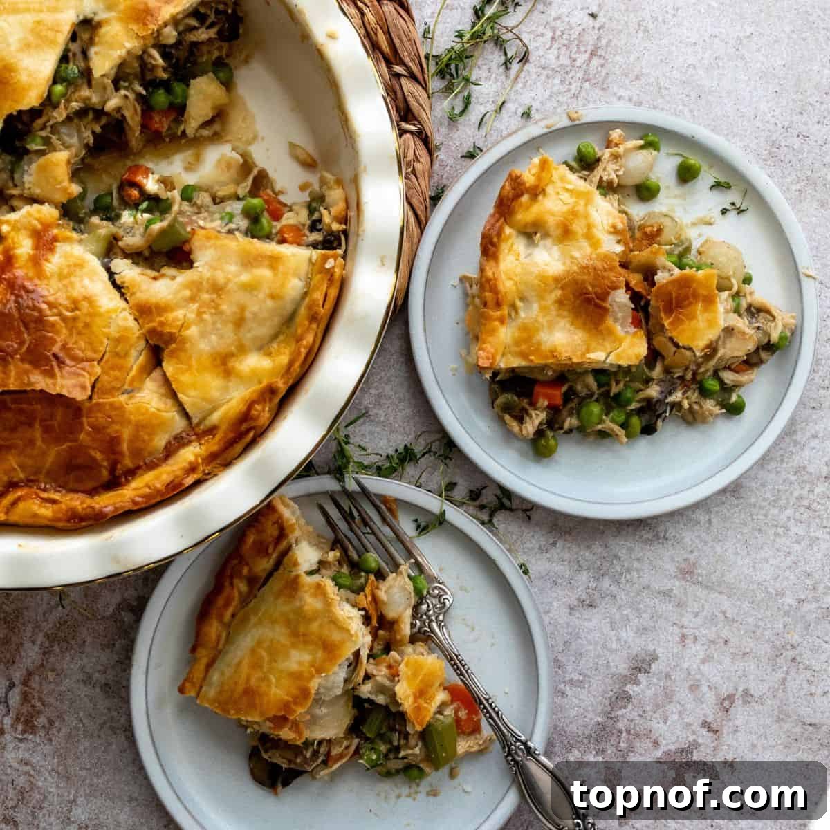 Healthy Chicken Pot Pie on plates with forks, ready to be enjoyed.