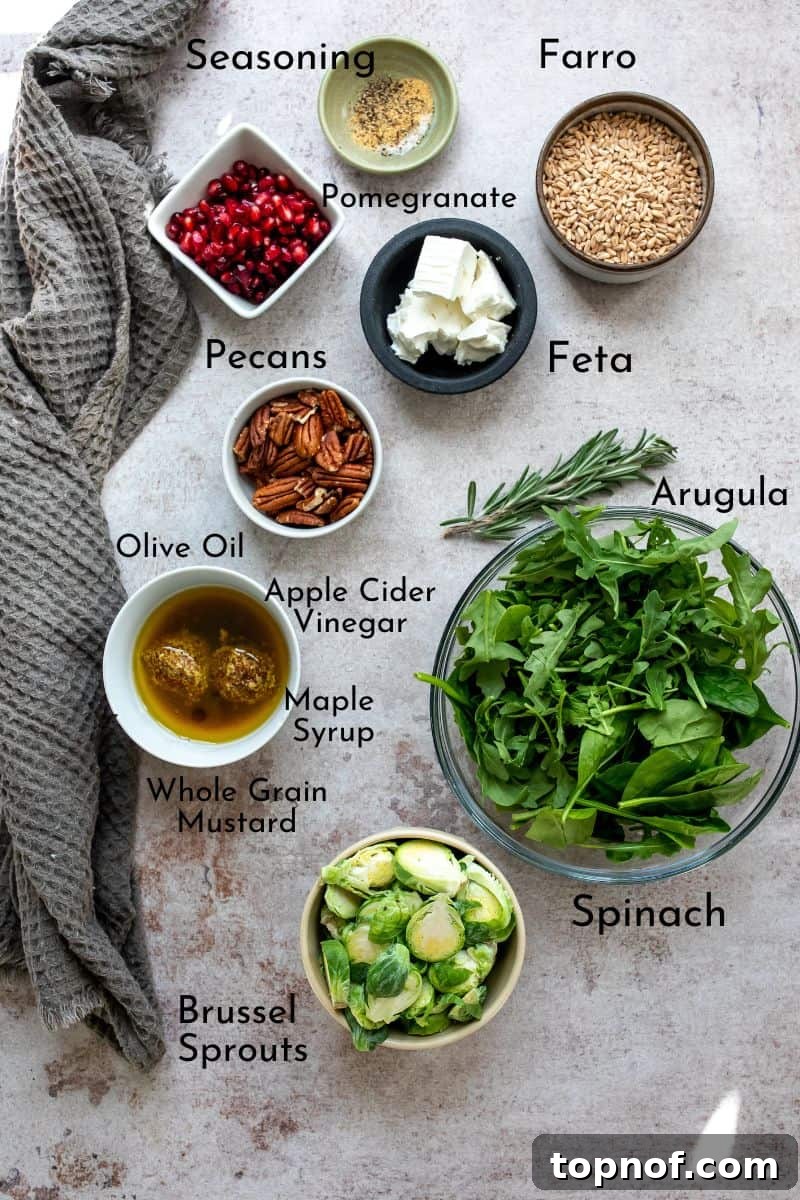 Autumn Farro Grain Bowl with Fresh Greens 3 A charming flat lay of fresh Fall Salad ingredients beautifully arranged on a rustic wooden board in small ceramic bowls.