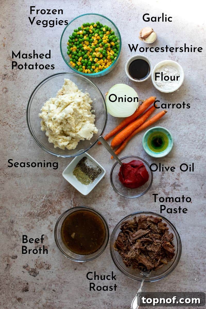 Bowls of fresh ingredients for Dairy-Free Shepherd’s Pie displayed on a kitchen counter, including chopped vegetables, meat, and seasonings.