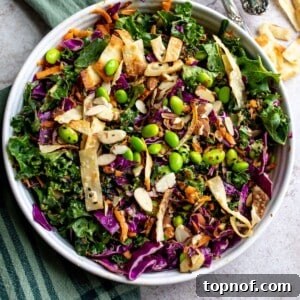 White ceramic bowl with Asian cabbage salad recipe in it.