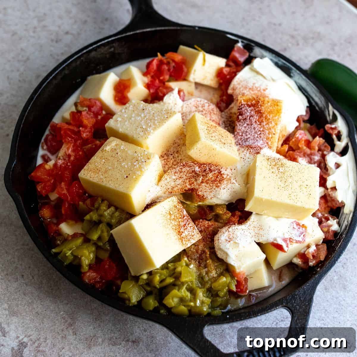 Artisan Smoked Queso 4 All ingredients for smoked queso piled into a cast iron skillet, ready for the smoker.
