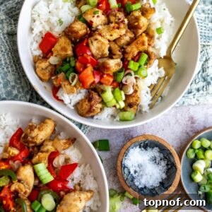 Crispy Chicken with salt and pepper seasonings served over rice with veggies.