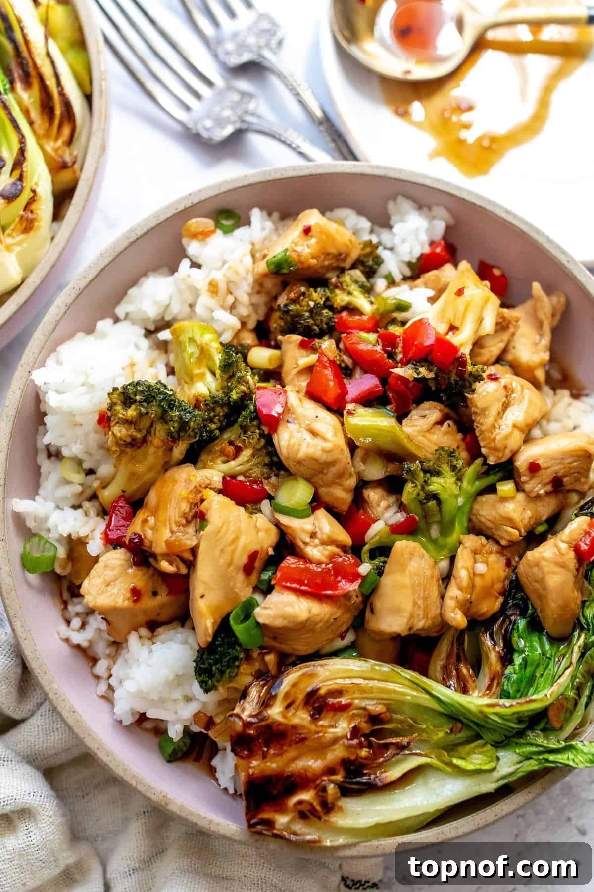 Glazed Teriyaki Chicken Power Bowl 6 Close-up view of perfectly assembled Teriyaki Chicken Bowls, showcasing the vibrant chicken, vegetables, and rice.