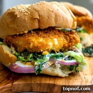Golden Crispy Chicken Burger 7 Crispy chicken burger on a bun with lettuce.
