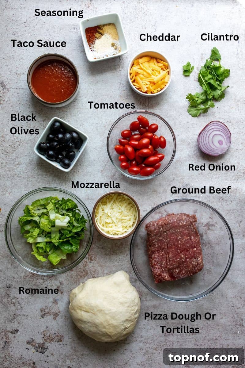 Tex-Mex Pizza 3 A kitchen counter showcasing small bowls filled with pizza ingredients like ground meat, sliced olives, and shredded cheese.