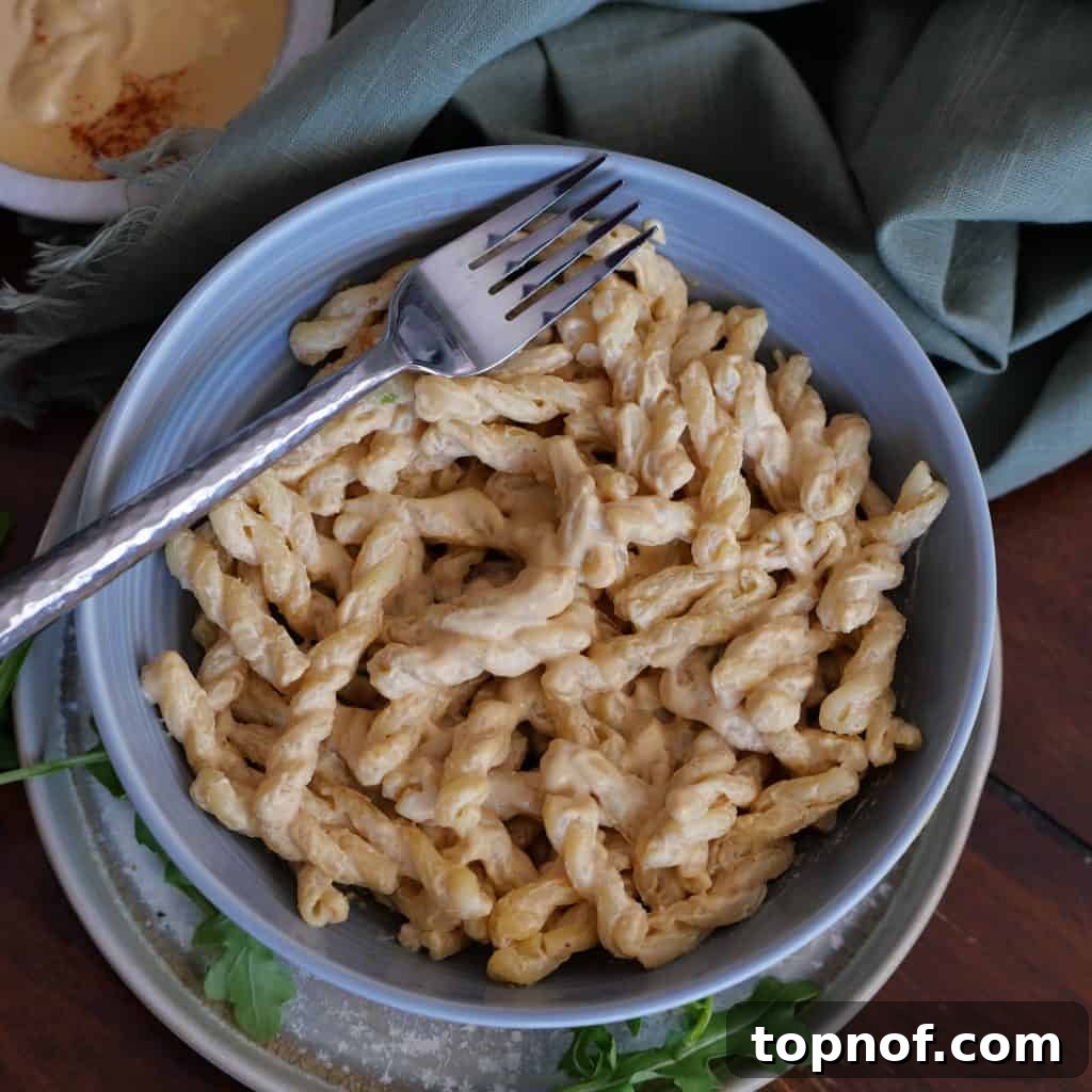 Creamy Dairy-Free Dream Sauce 3 Close-up of creamy Easy Vegan White Cheddar Sauce in a bowl, ready for serving.