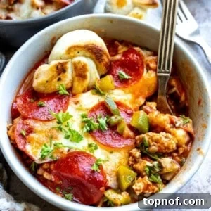 White bowl with ground meat and pepperoni.