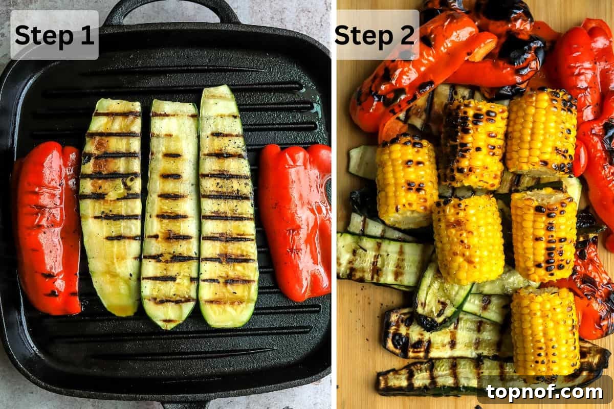 Smoky Zucchini Garden Salad 4 Grill pan with sliced zucchini, bell peppers, and corn on it, showing visible grill marks, in the process of cooking.