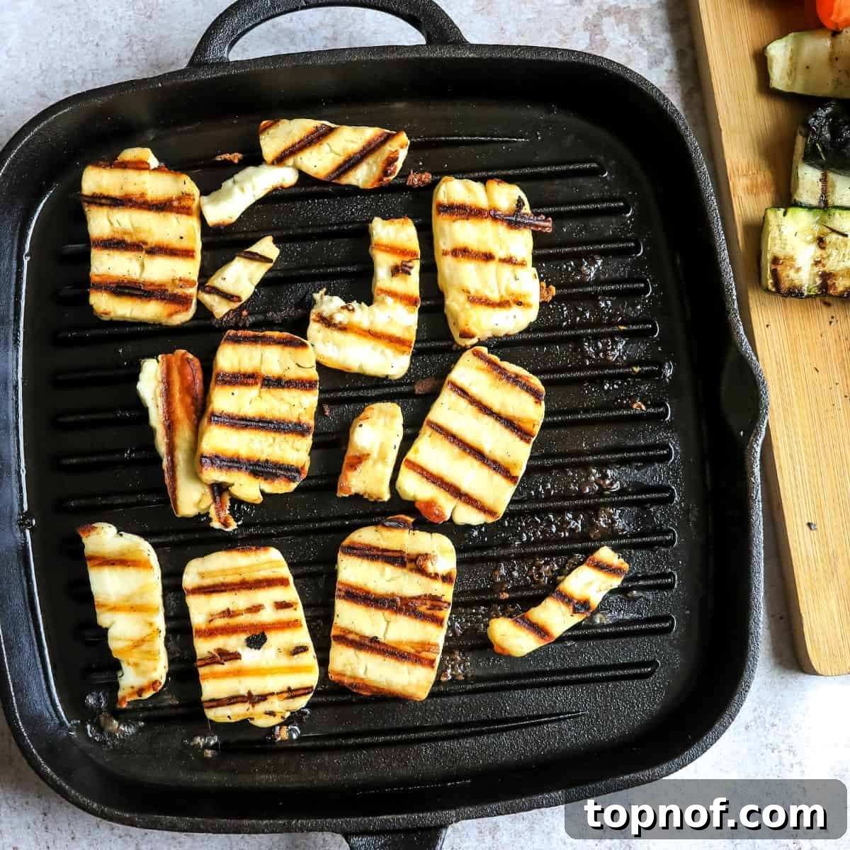 Smoky Zucchini Garden Salad 5 Grill pan with golden brown halloumi cheese showing perfect grill marks.