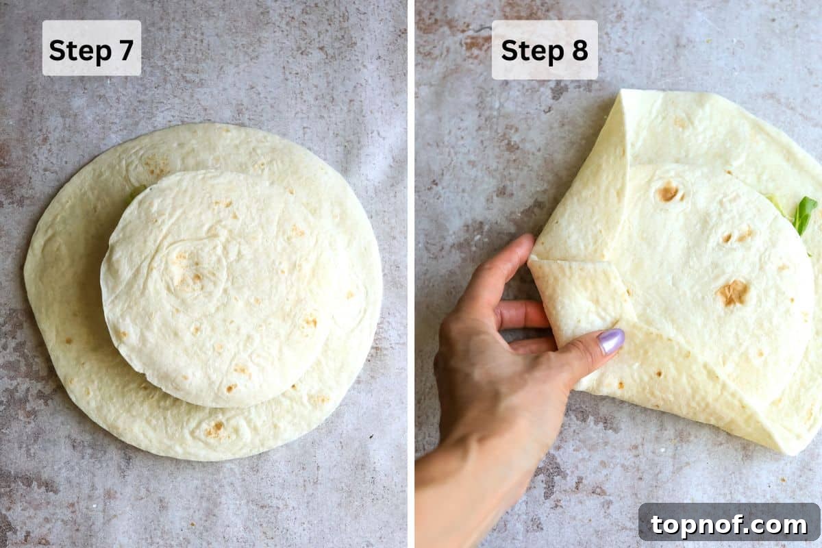 The final step of folding the large tortilla inwards to seal the crunchwrap.