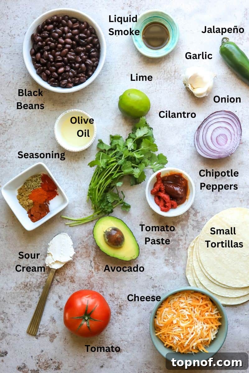 Golden-Crisp Black Bean Tacos 3 A vibrant display of ingredients for crispy black bean tacos, arranged in small bowls and on plates on a kitchen counter.