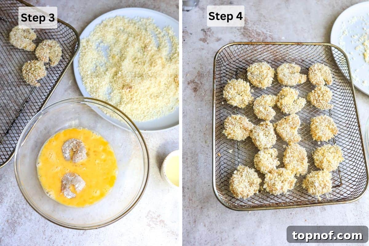 Golden Crunchy Panko Shrimp 5 Panko-coated shrimp arranged in a single layer on an air fryer tray, ready for cooking.