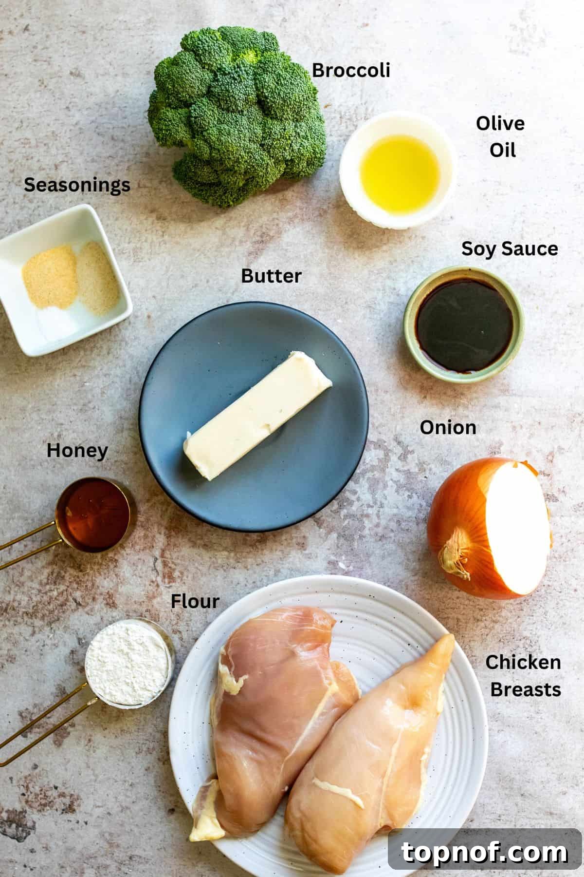One-Pan Honey Butter Glazed Chicken 3 Ingredients on a plate and in small bowls with sauces and veggies.