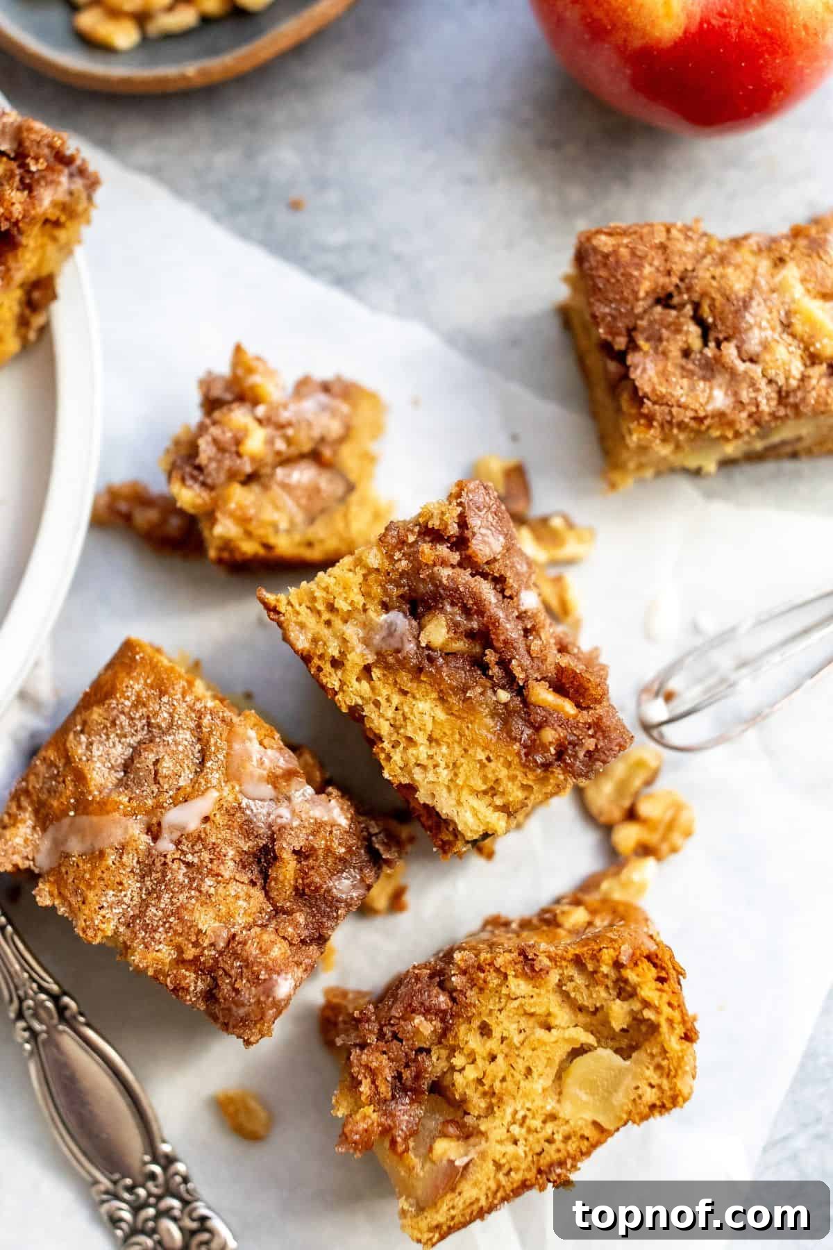 A beautifully baked Apple Cinnamon Cake, showcasing its golden-brown crust and inviting cinnamon sugar topping, perfect for a cozy fall day.