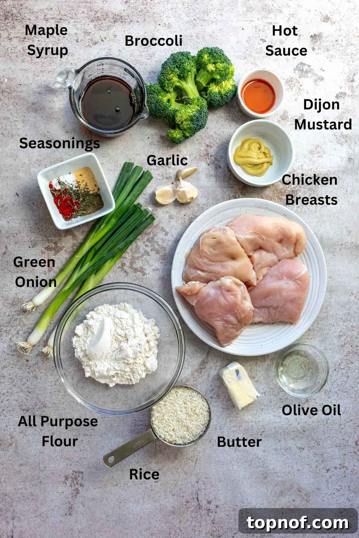 Maple Glazed Chicken 3 Ingredients needed to make the recipe in small bowls on a counter.