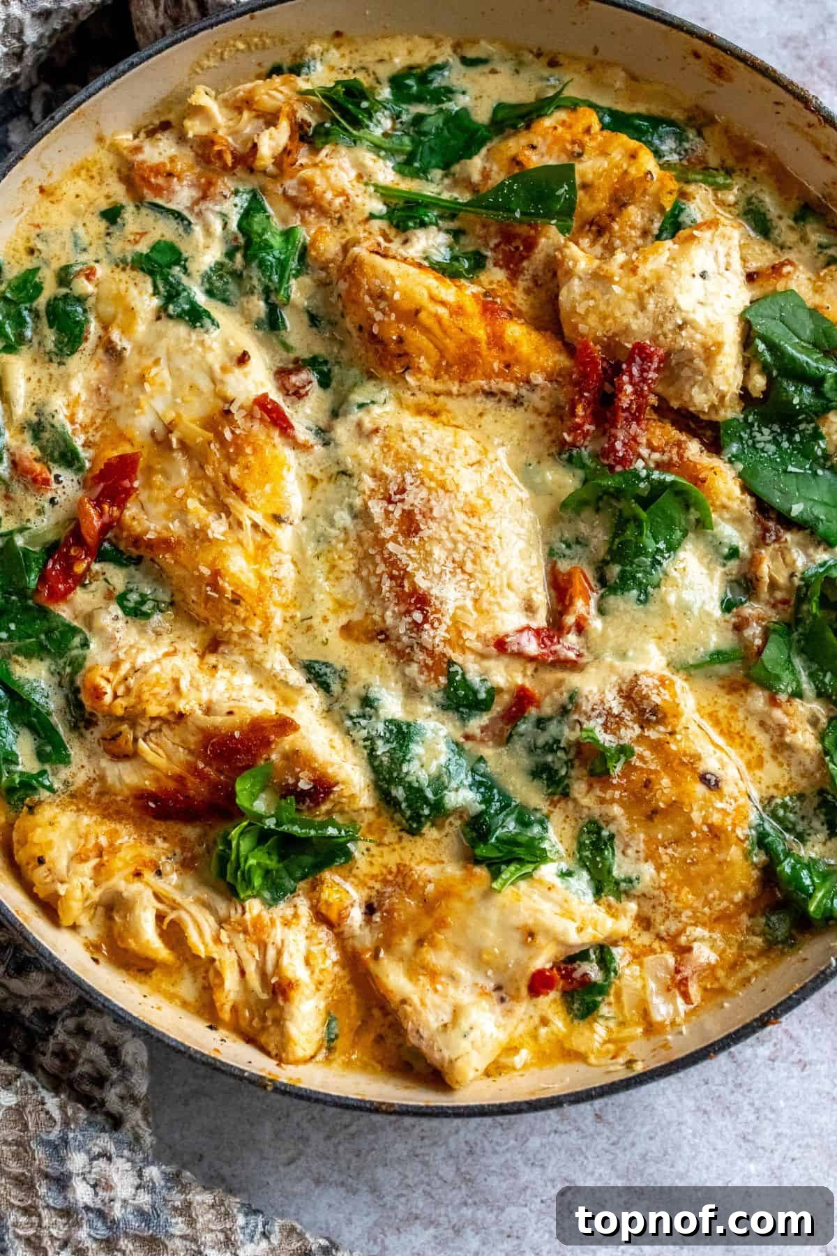 Creamy Tuscan Chicken Skillet 6 A large skillet brimming with creamy Tuscan chicken, spinach, and sun-dried tomatoes.
