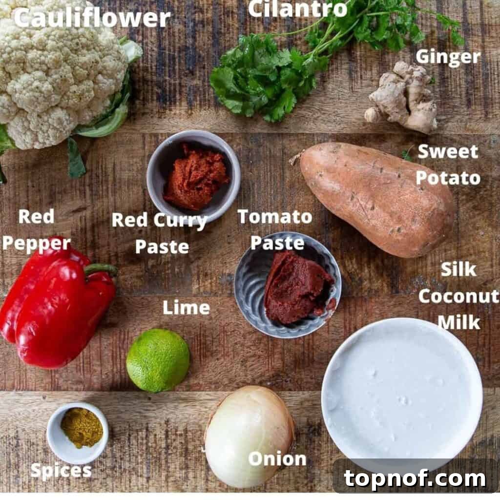 Spiced Cauliflower and Potato Curry 4 A selection of fresh ingredients laid out for making cauliflower sweet potato coconut curry.