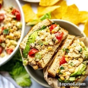 Chickpea Salad Sandwiches in a bowl wrapped in parchment paper.