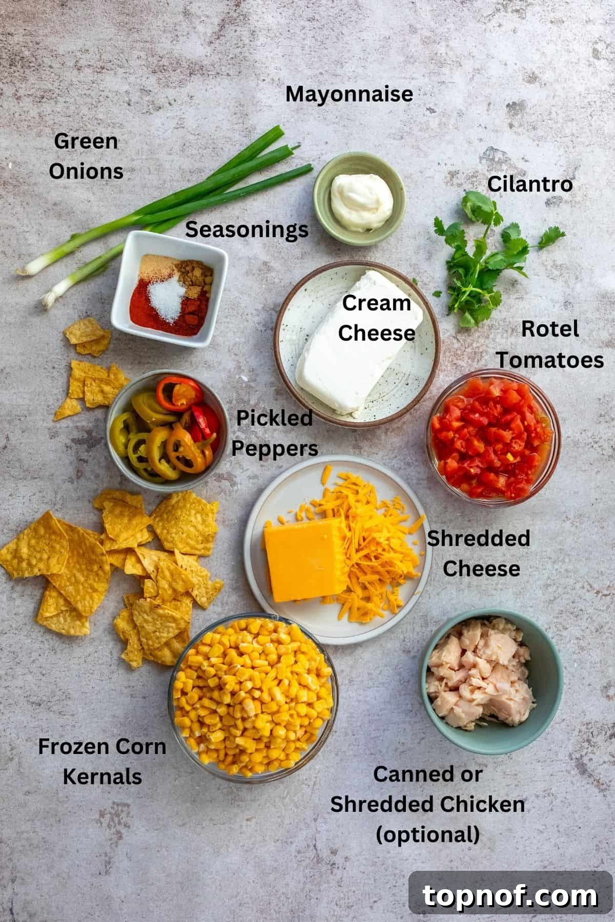 Golden Creamy Corn Delight 3 All ingredients needed to make the recipe on a counter. Small bowls filled with veggies, seasonings and more.