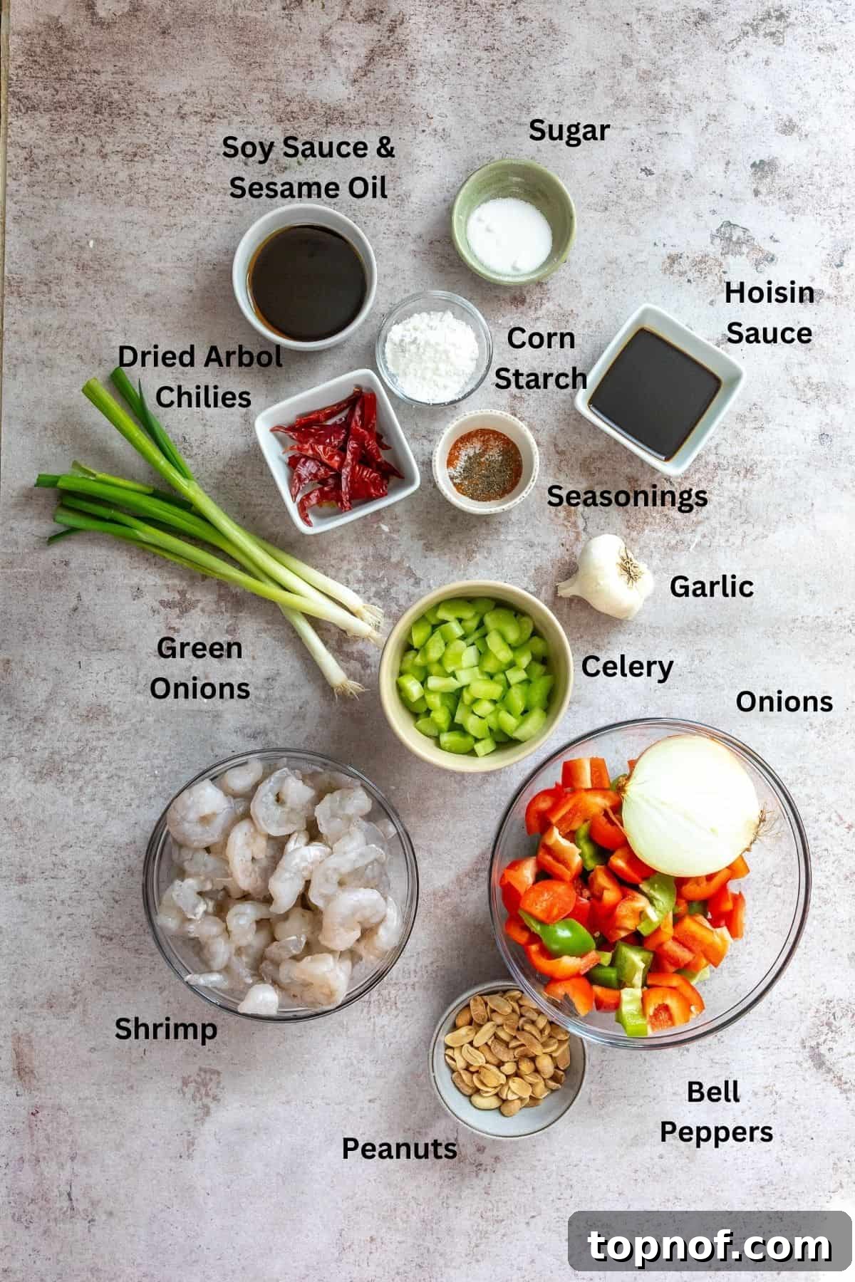 Spicy Szechuan Kung Pao Shrimp 3 Fresh ingredients needed in bowls and in small glass dishes on a counter.