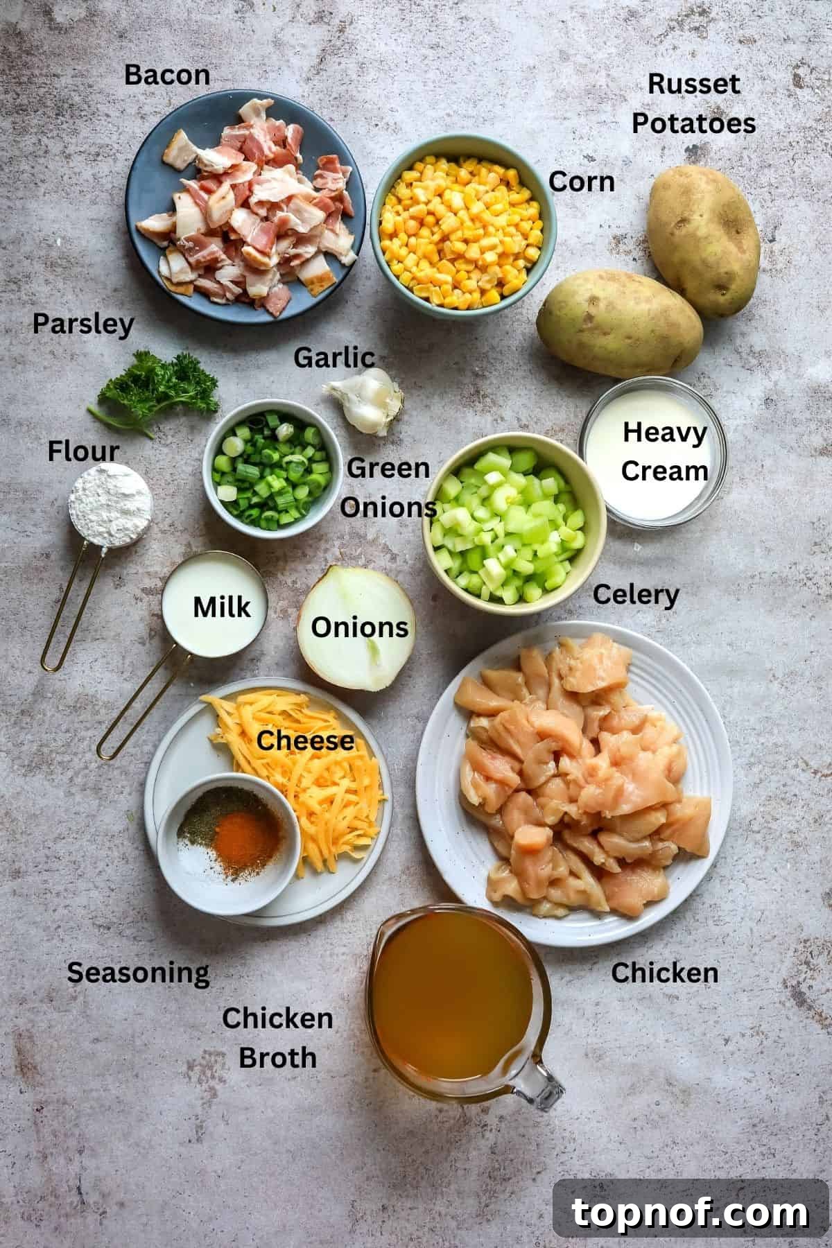 Golden Chicken Corn Chowder 3 Ingredients needed to make this recipe on a counter in mixing bowls and measuring cups.