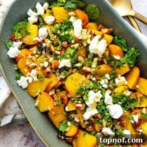 Roasted Golden Beets on a green serving plate with toppings.