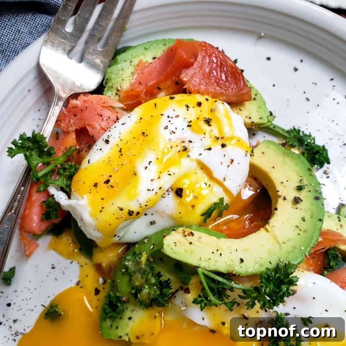 Decadent Smoked Salmon Eggs Benedict, featuring perfectly poached eggs, smoked salmon, and a rich hollandaise sauce.