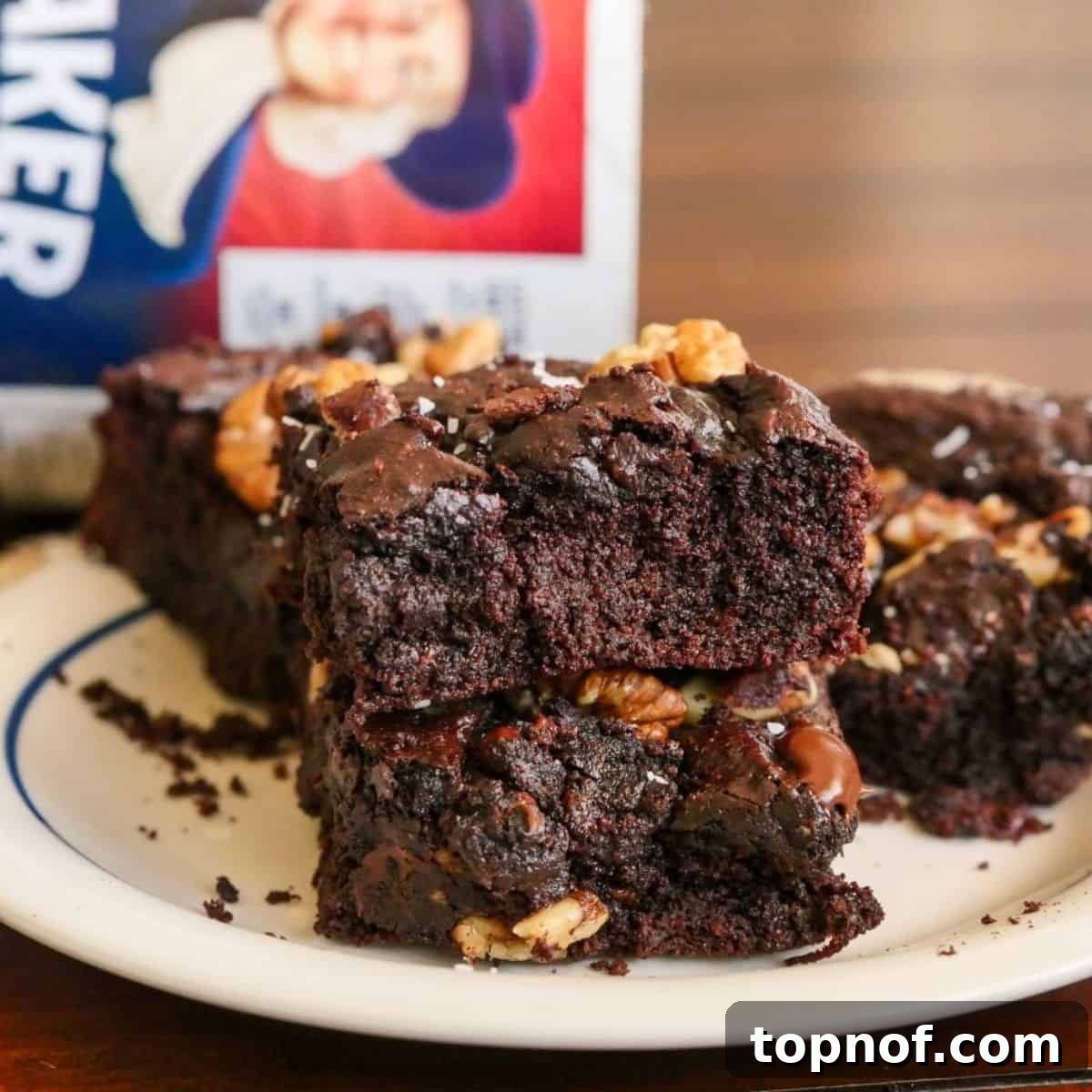 Wholesome Oat Brownies 3 Decadent Gluten Free brownies on a white plate ready to be enjoyed.