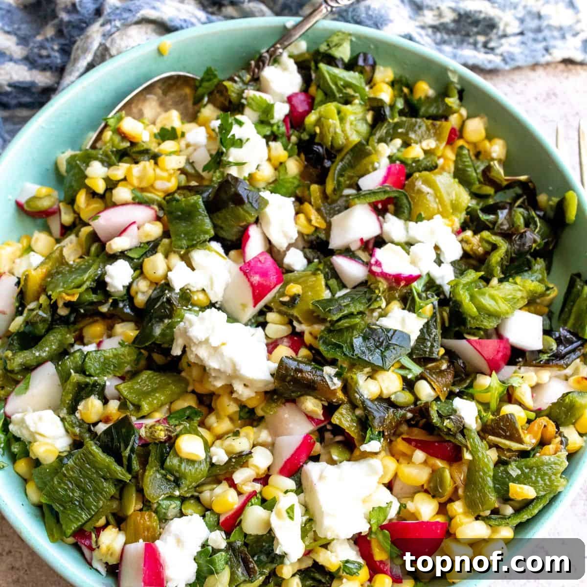 A vibrant bowl of Roasted Corn Salad With Poblano Peppers, offering a delightful texture.
