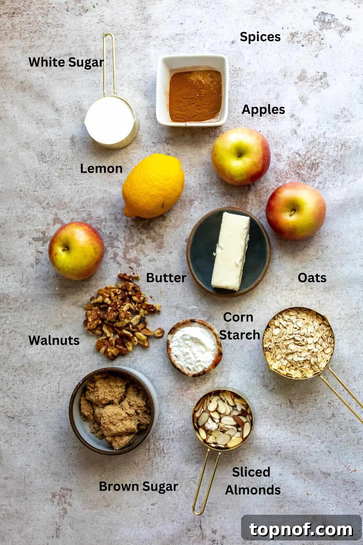 Set-It-and-Forget-It Apple Crisp 3 Overhead shot of all ingredients needed to make slow cooker apple crisp laid out on a kitchen counter.
