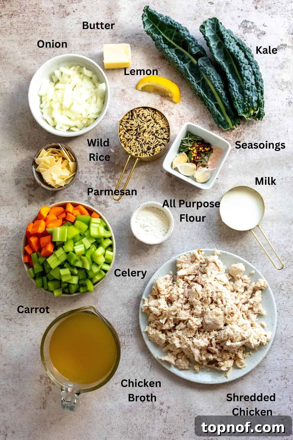 Velvety Chicken Wild Rice Soup 3 Ingredients needed to make Creamy Chicken Wild Rice Soup displayed on a kitchen counter.