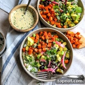 Sweet Potato and veggies in grey Bowls on a dish towel, beautifully presented and ready to eat.