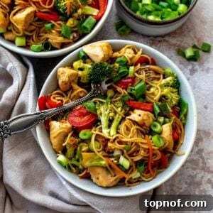 Teriyaki Chicken Ramen in a grey bowl with a dish towel on the side.