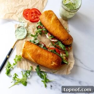 Green Goddess Caprese Melts on parchment paper with dressing to the side.
