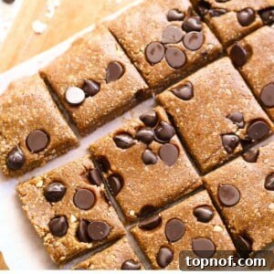 A close-up of a finished dairy-free granola bar, showcasing its texture and ingredients.