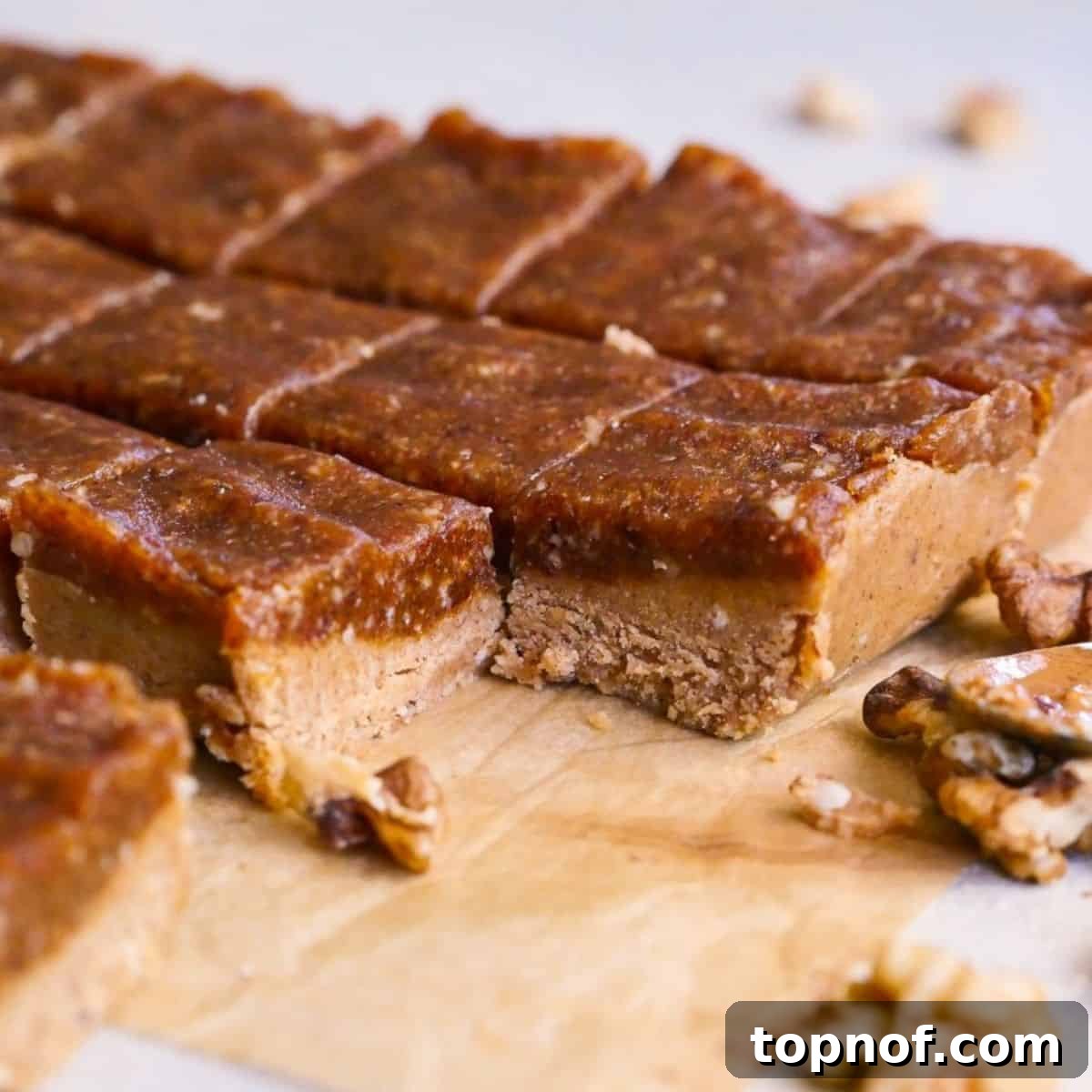 Golden Chewy No-Bake Blondie Squares 2 Delicious chewy no-bake blondies, a healthy date bar recipe, on a serving plate.