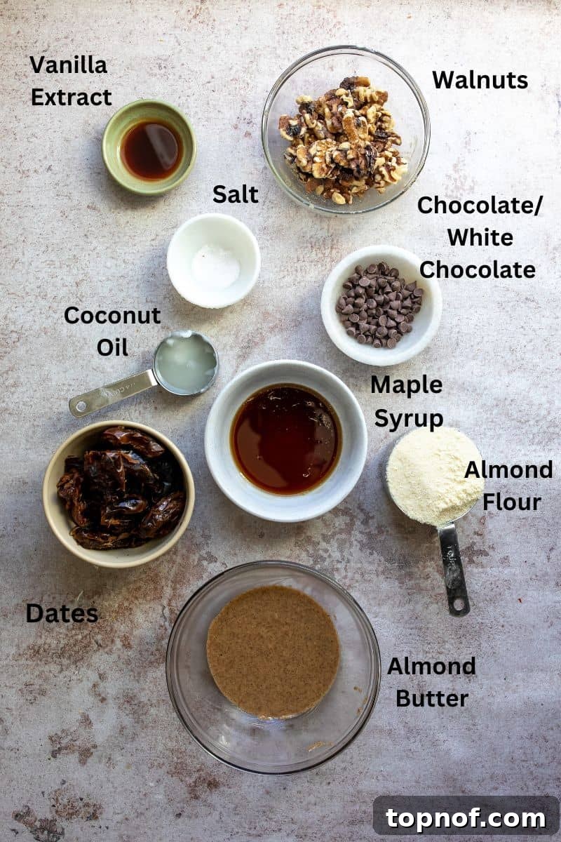 Golden Chewy No-Bake Blondie Squares 3 Ingredients for healthy no-bake blondies laid out in small bowls, including almond flour, almond butter, dates, and walnuts.
