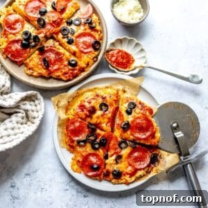 Chicken Pizza Crust on plates with a spoon to the side.