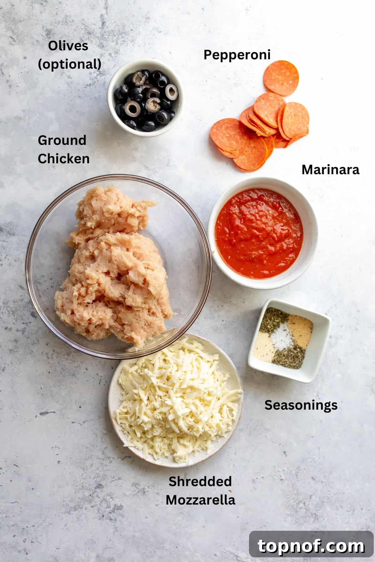 Keto Chicken Pizza 3 Ingredients needed to make this recipe on a counter in bowls. Fresh ground chicken, seasonings, marinara, and mozzarella.