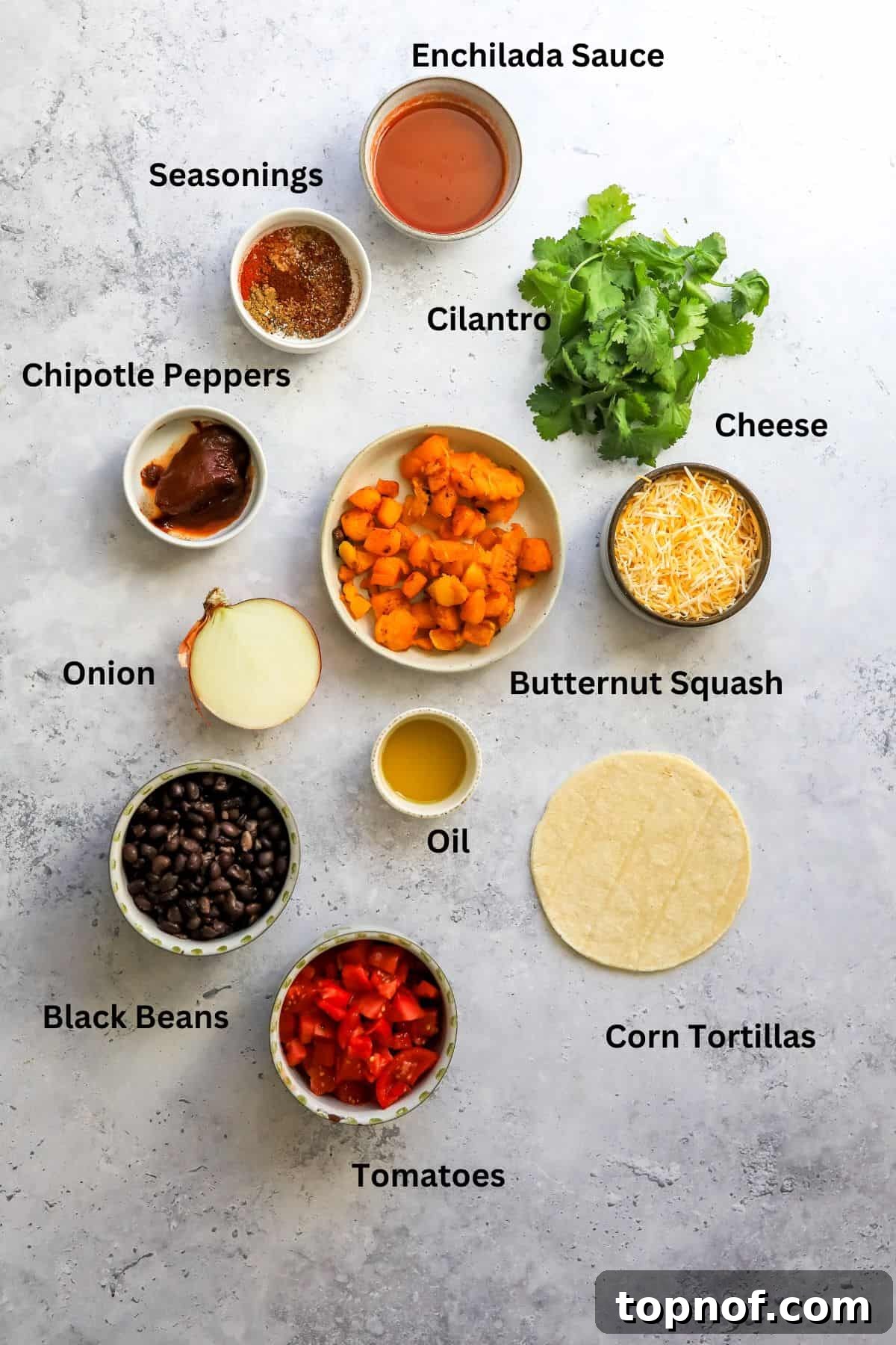 Smoky Butternut Squash Enchiladas 3 All the fresh and pantry ingredients laid out on a clean marble countertop, ready for preparation of the enchiladas.