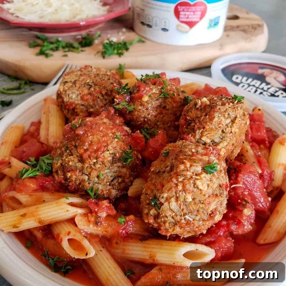 Wholesome Veggie Poppers 6 A vibrant and appealing serving of vegetarian meatballs resting in a bowl of rich red marinara sauce, garnished with fresh basil. The image evokes a sense of comfort and deliciousness, highlighting that these hearty veggie balls are ready in under 30 minutes.