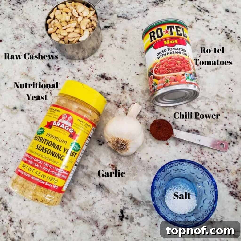 Vegan Rotel Queso 3 Ingredients for vegan queso laid out on a table, including nutritional yeast, cashews, and Ro-tel tomatoes.
