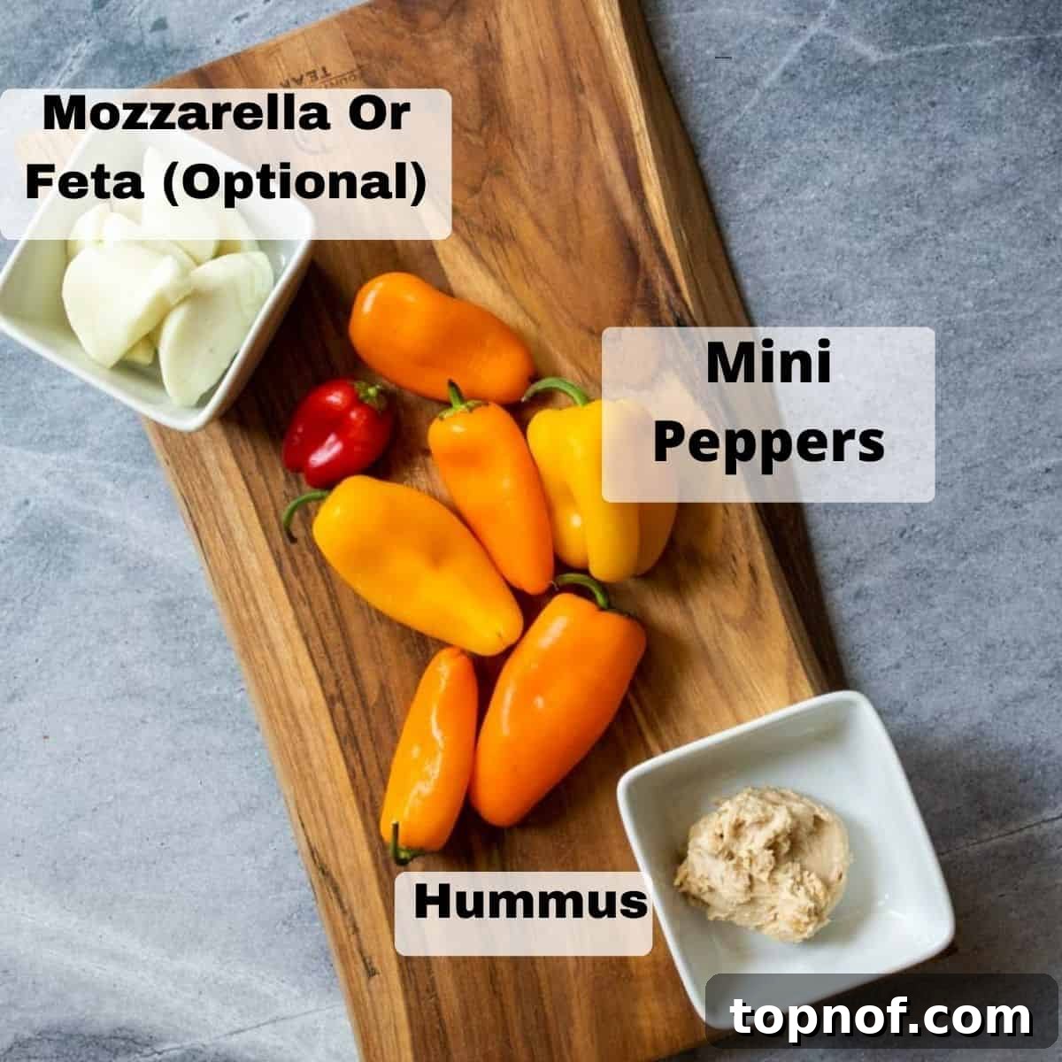 Vegetarian stuffed peppers ingredients on a wood board. 