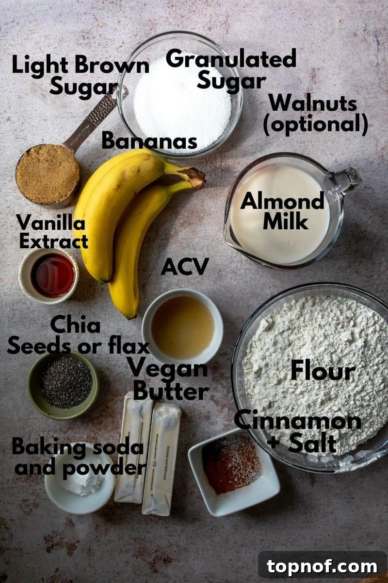 Ultimate Vegan Banana Cake 3 A flat lay photo showing all the ingredients for vegan banana cake laid out on a wooden board.