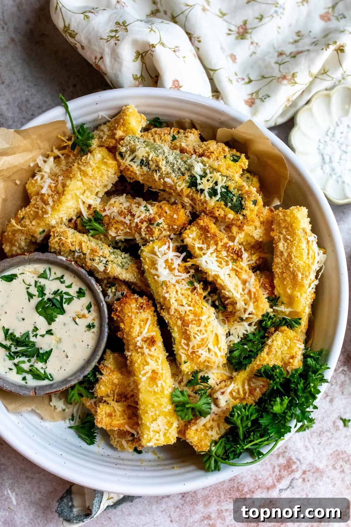 Crunchy Air-Fried Zucchini Sticks 2 Air fryer Zucchini fries on a plate with dip.