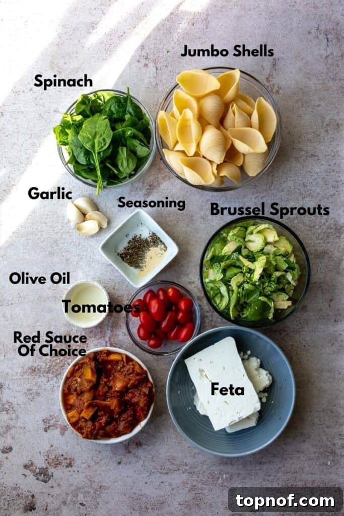 Ingredients for veggie stuffed shells laid out on a wooden board.